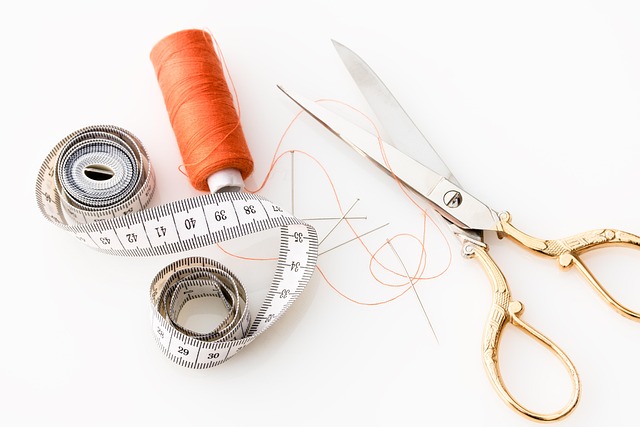 family learning workshop table with fabric scraps thread and kid-friendly craft tools